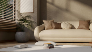Modern cream curved sofa in family-friendly living room.